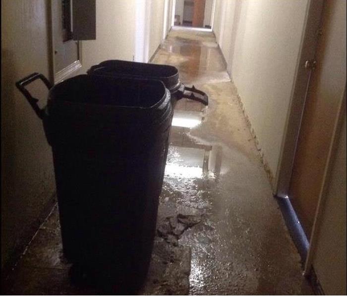 Standing water in a hallway.