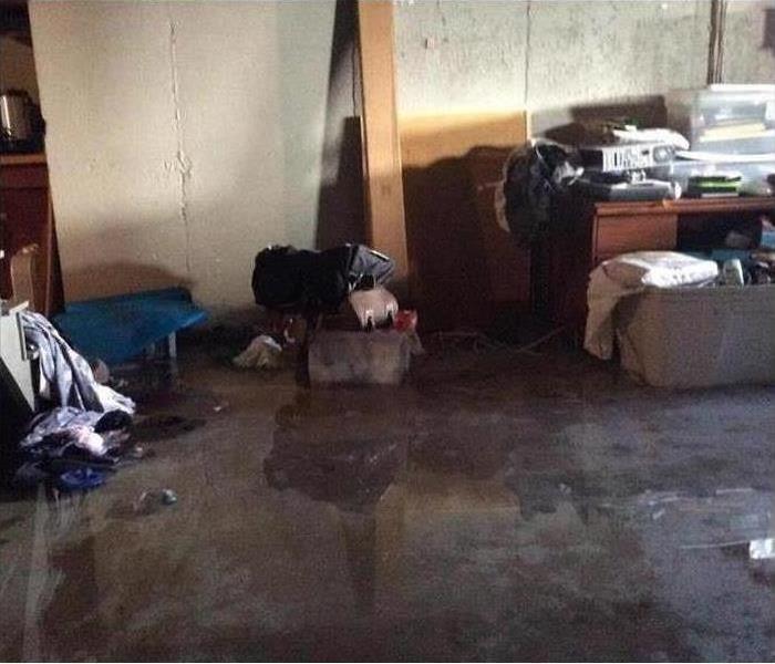 Standing water in a basement, personal items wet